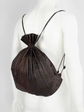 Issey Miyake dark brown drawstring backpack with fine pressed pleats