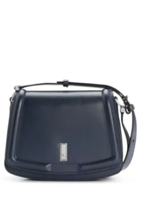 Leather saddle bag with signature hardware and monogram