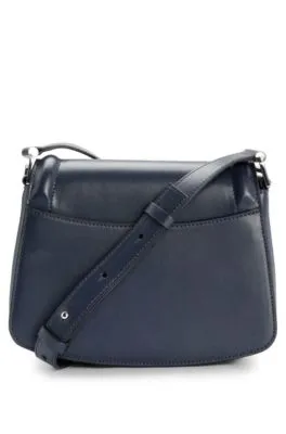 Leather saddle bag with signature hardware and monogram