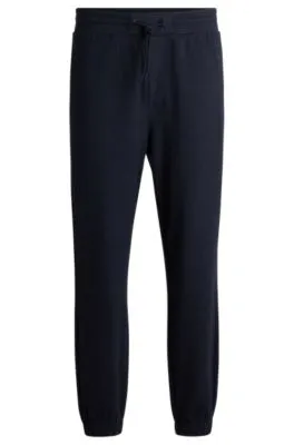 Regular-fit tracksuit bottoms in performance fabric