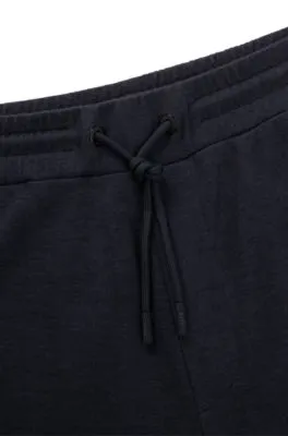 Regular-fit tracksuit bottoms in performance fabric