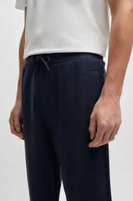 Regular-fit tracksuit bottoms in performance fabric